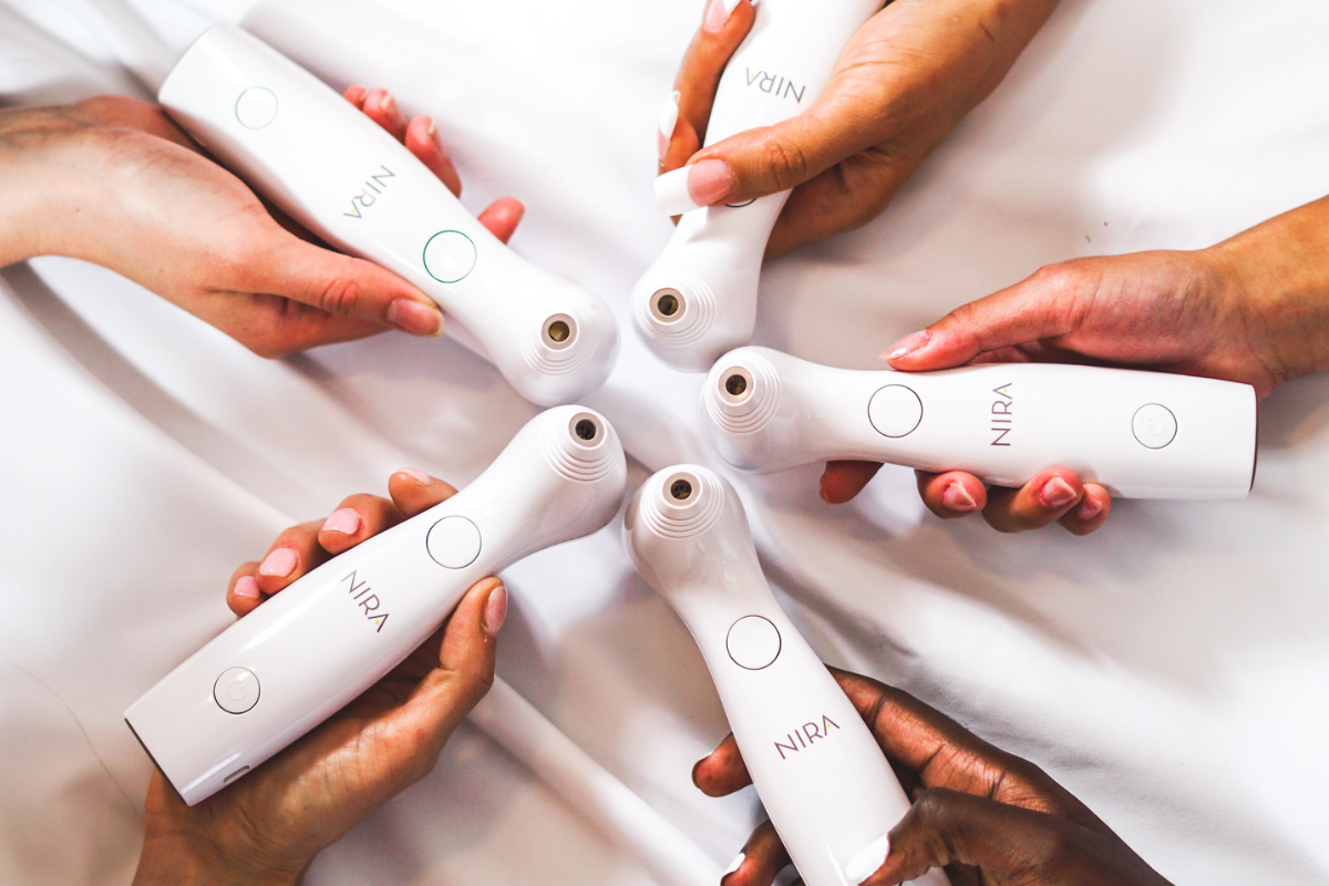 NIRA lasers arranged in a circle, showcasing advanced skincare technology for at-home and professional treatments.