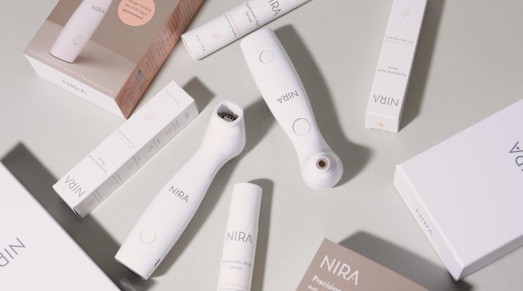 Various NIRA skincare products including the NIRA Pro laser, NIRA Precision laser, and Hyaluronic Acid Serum