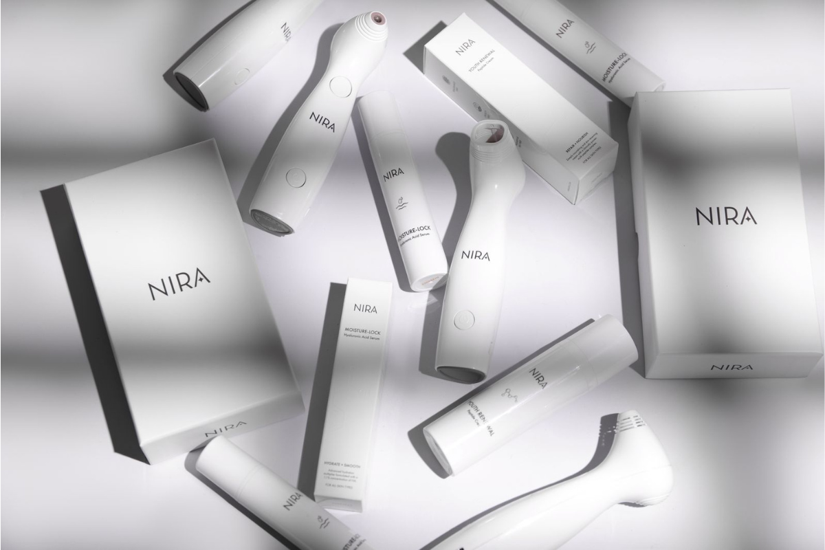 All NIRA Skincare lasers and products displayed around the central box, showcasing at-home laser devices and anti-aging skincare for wrinkle reduction, skin tightening, and collagen-boosting treatments.