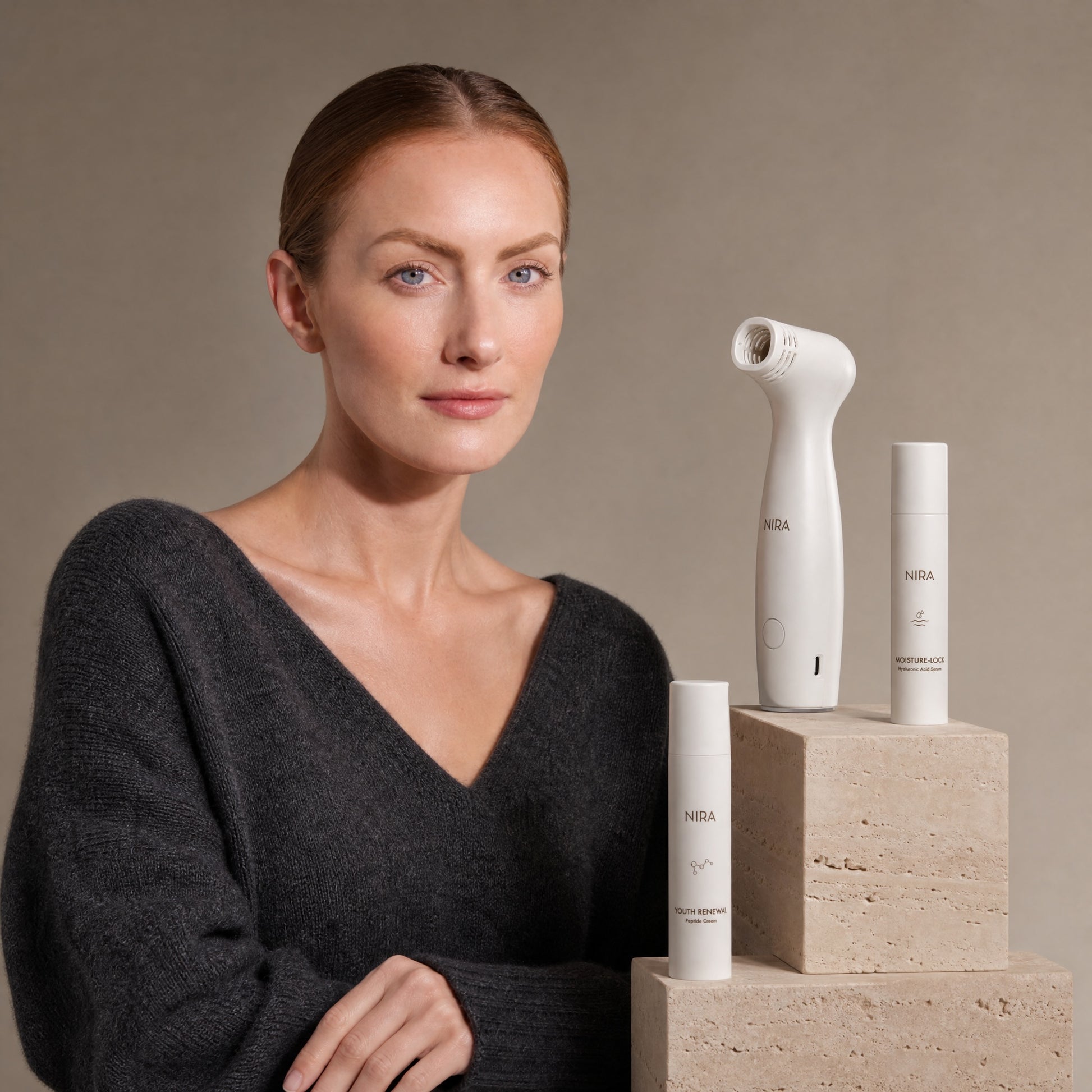 White nira pro 3 laser and skincare bundle device with sleek ergonomic design and minimalist branding on matte finish body