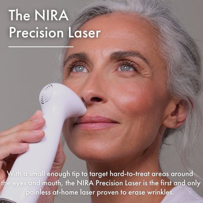 Woman using the NIRA Precision Laser to target hard-to-reach areas around the eyes and mouth