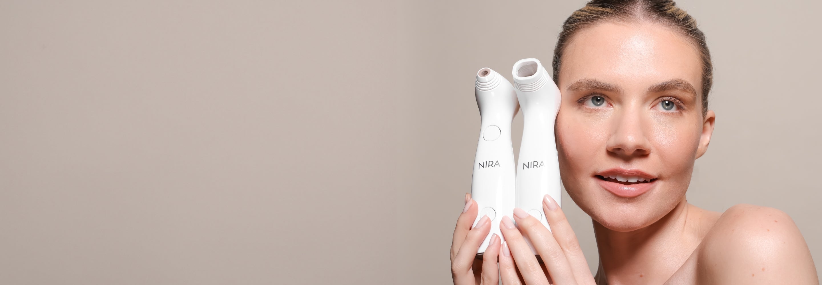 Woman holding the world's safest and most effective at-home laser