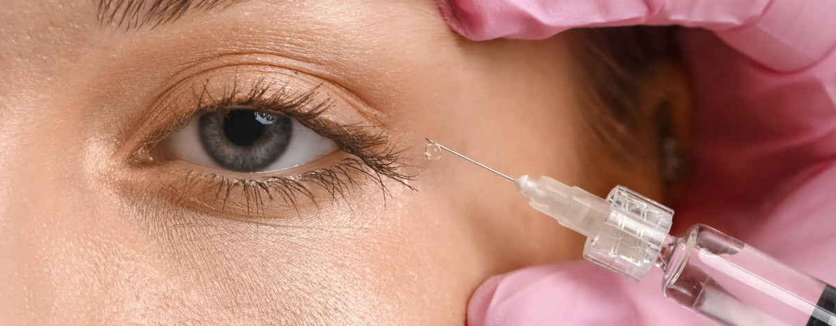 Woman getting cosmetic injections to treat crow’s feet and under eye wrinkles