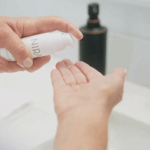 Dispensing NIRA serum from the tube into the palm after a Pro 3 treatment